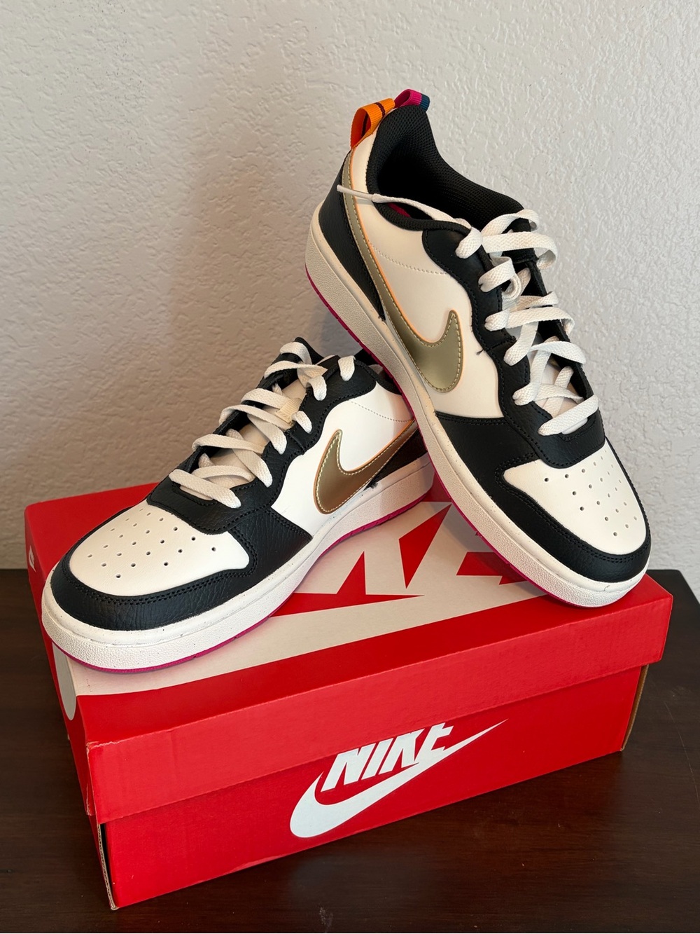 Nike Navy, White & Gold Low-Top Sneakers with Pink and Orange Accents